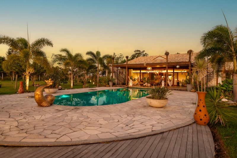 Tranquil backyard with a pool and palm trees